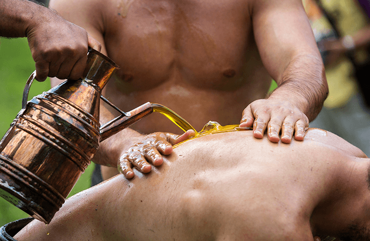 Pouring oil on wrestlers