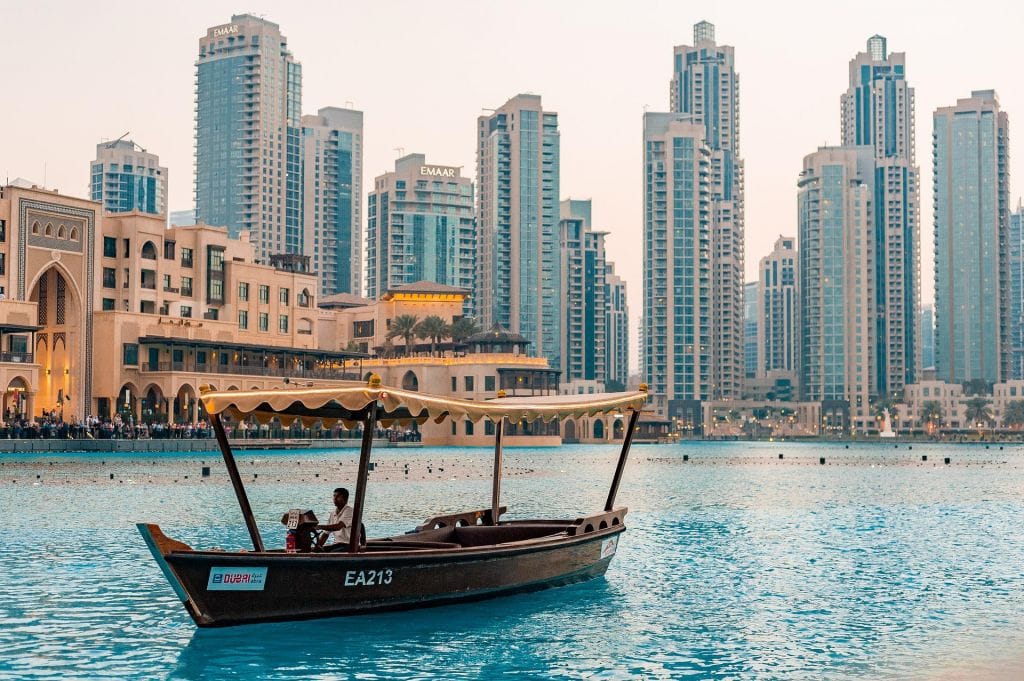 Exciting Ideas Tours Adventures in Dubai in 2022 Dubai skyline with abra boat