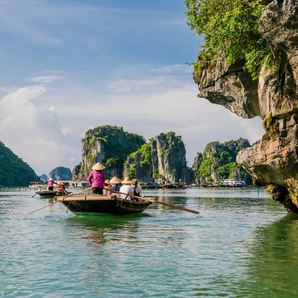 Tourists enjoying a boat trip with local guides through the maje Contiki Vietnam Hanoi Halong Bay Ho Chi Minh City Hue Hoi An Nha Trang