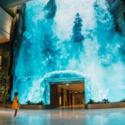 Be transported to a captivating realm as a grand digital waterfall descends at T2s departure hall