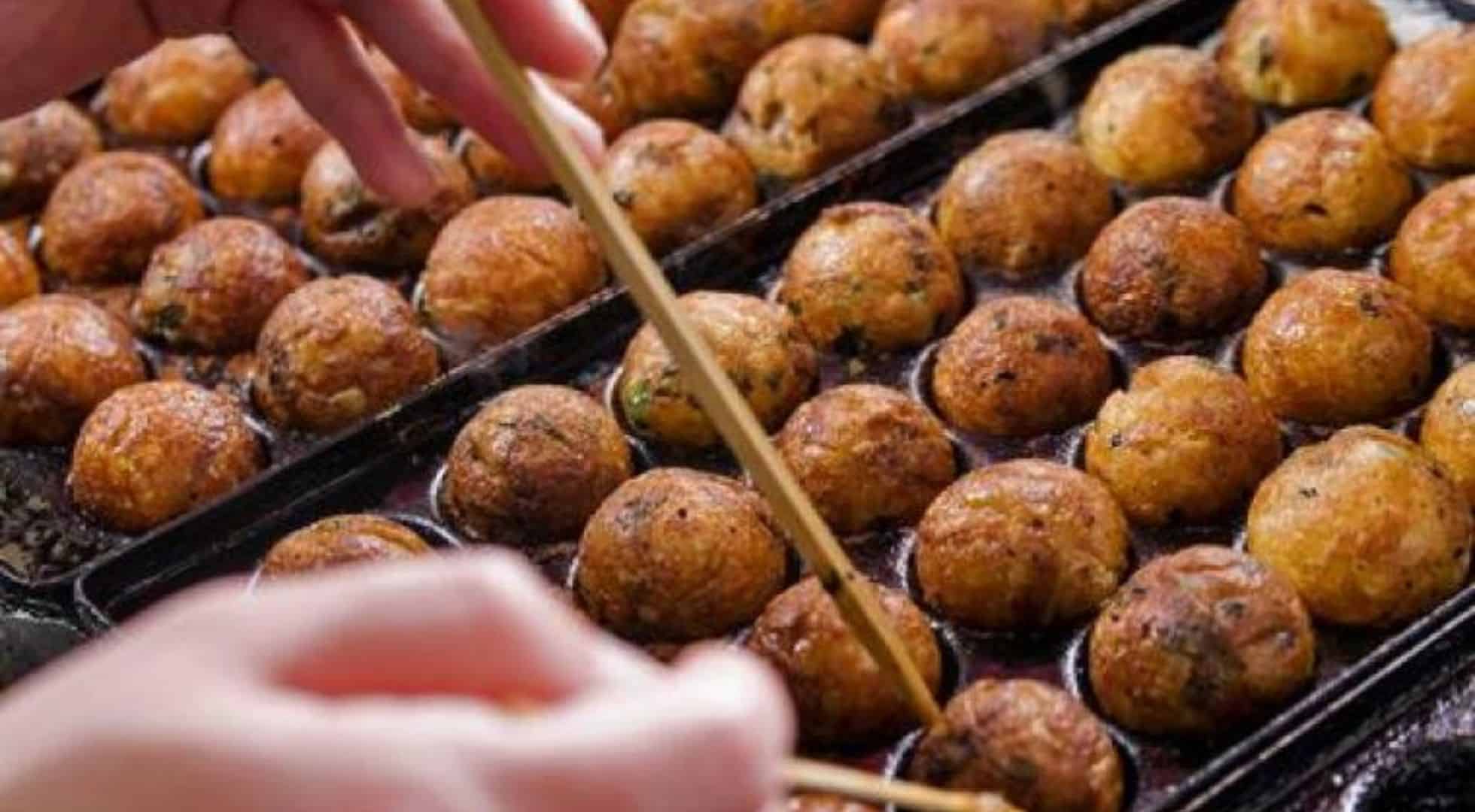 Image of takoyaki squid balls which is a popular street featured in the best food festivals in Japan.